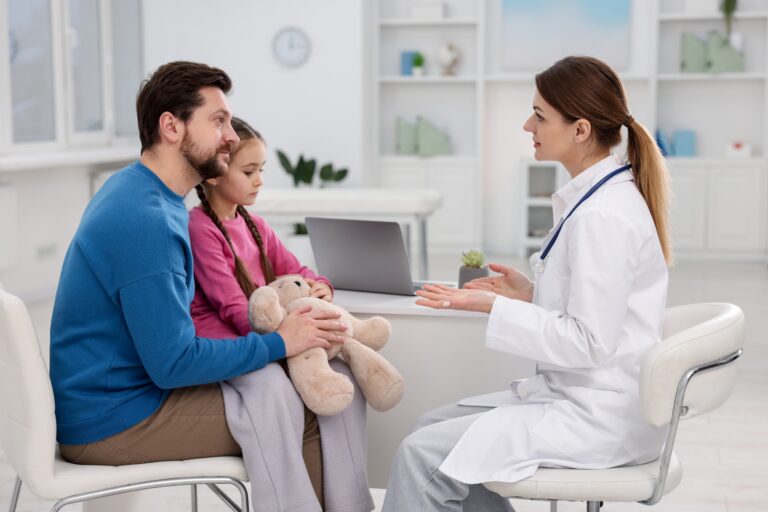Little,Girl,And,Her,Father,Having,Appointment,With,Doctor,In